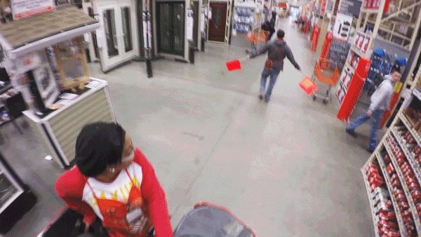 Home Depot employee navigating a forklift through the store.