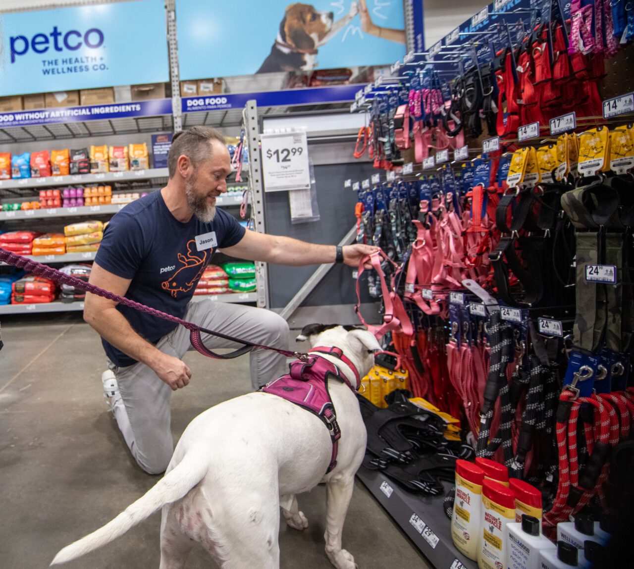 A Petco "partner" helps a customer find just the right product at Petco shop-in-shop in Lowe's.