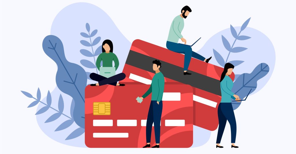 Image with four people interacting with giant credit cards, illustrating credit card use in the B2B industry. 